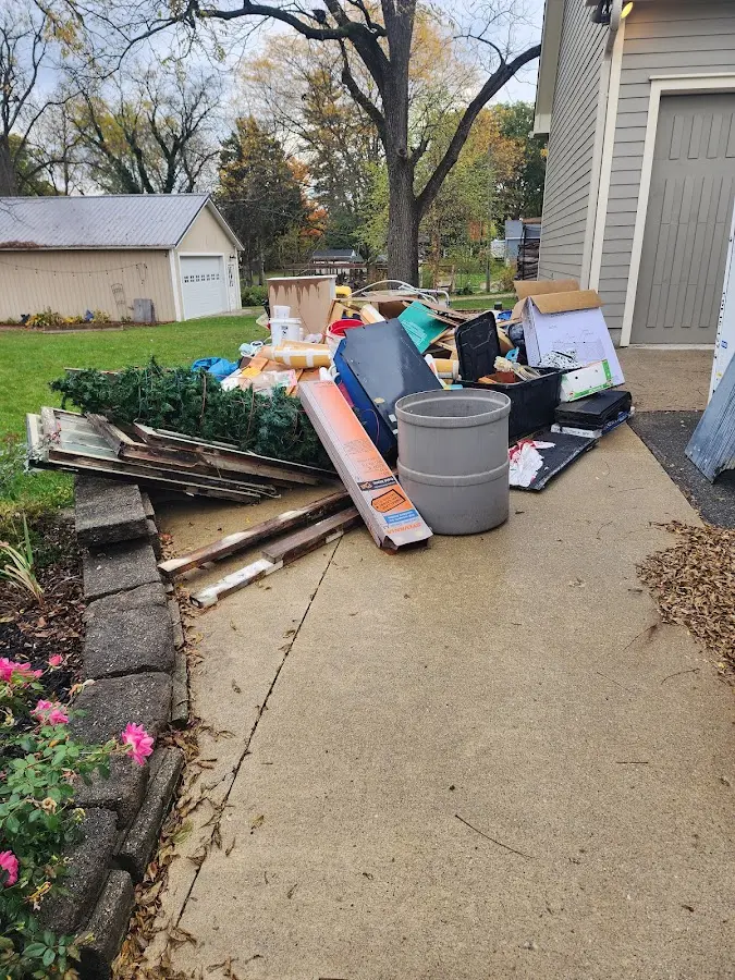 Dumpster being loaded with debris for 3 Yard Dumpster Rental in Caribou
